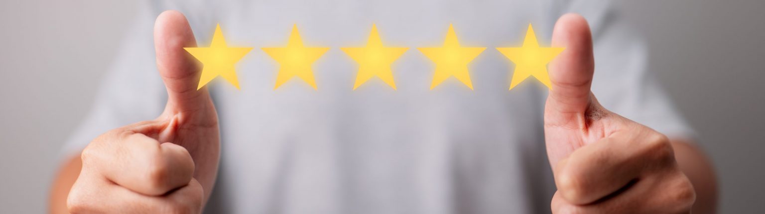 Concept of Customer Experience. With a five-star rating, a happy client gives a thumbs up for great. Excellent Services for Customer Satisfaction.
